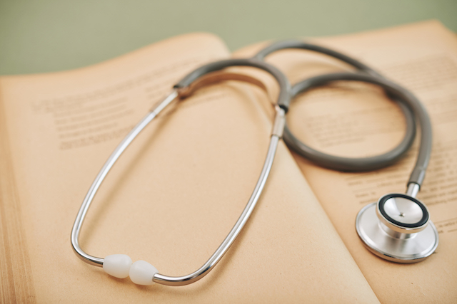 Stethoscope and book to signify fraud health check feature
