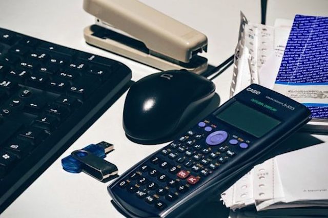 calculator set up to represent what forensic accounting involves feature