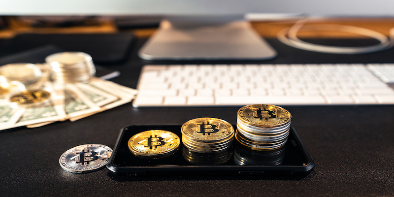 stacked-bitcoins-grow-on-the-desk