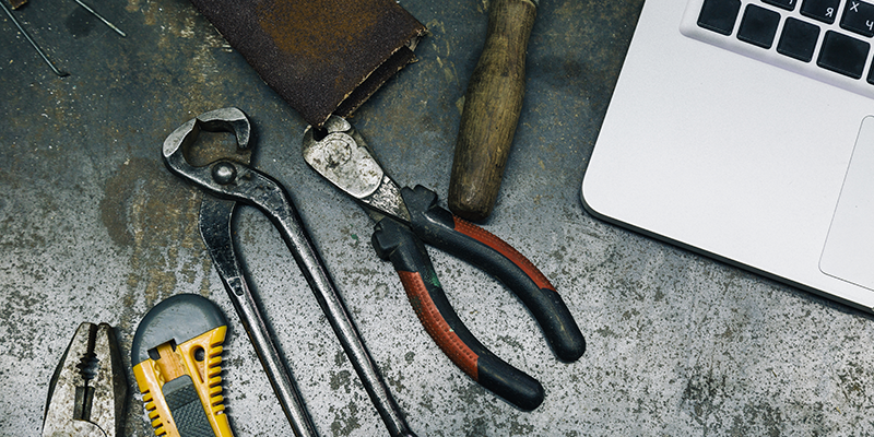 tools-on-table-with-laptop-representing-crypto-forensic-tools-techniques